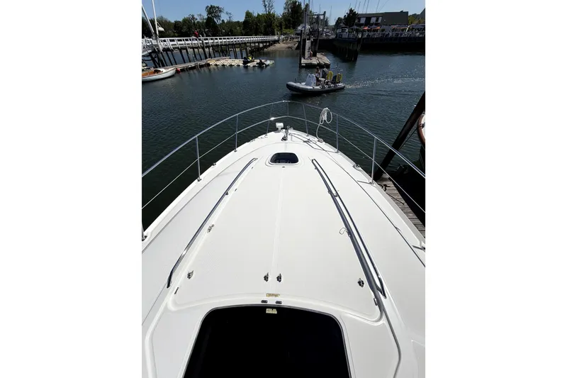 Slide: The Image of 2006 Sea Ray 40 Sundancer yacht docked at marina, viewed from bow. - 36