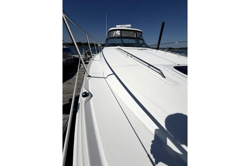 Slide: The Image of 2006 Sea Ray 40 Sundancer yacht docked under clear blue sky. - 37
