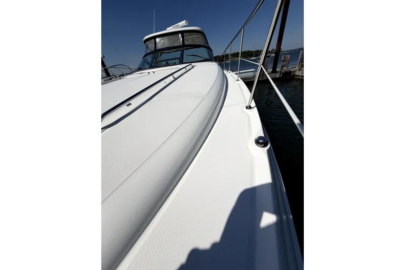 Slide: The Image of 2006 Sea Ray 40 Sundancer yacht deck, sleek design, docked by the water. - 38