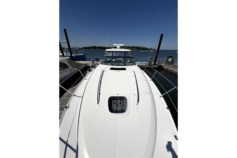 Slide: The Image of 2006 Sea Ray 40 Sundancer yacht docked at marina under clear blue sky. - 39