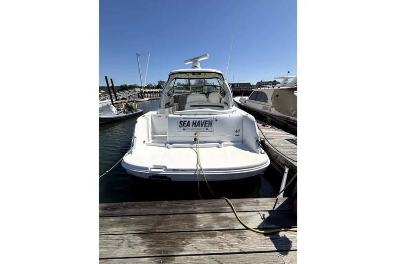 Slide: The Image of 2006 Sea Ray 40 Sundancer yacht docked at marina, rear view. - 41
