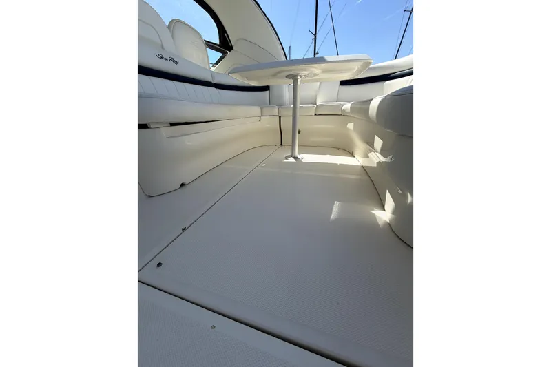 Slide: The Image of Interior of 2006 Sea Ray 40 Sundancer yacht with white seating and table. - 44