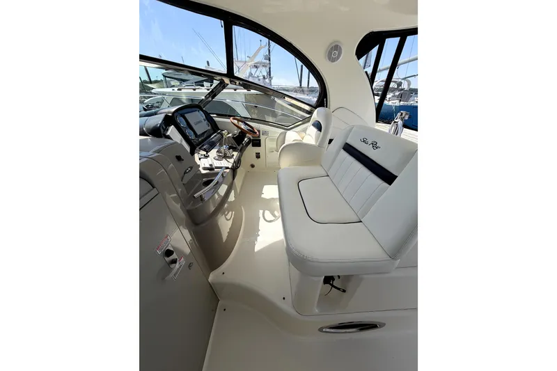 Slide: The Image of Interior of 2006 Sea Ray 40 Sundancer yacht with helm and seating area. - 47