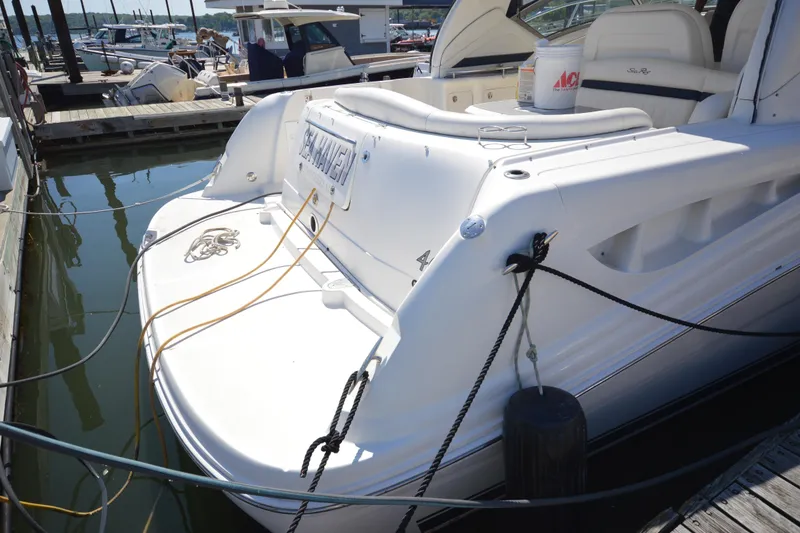Slide: The Image of 2006 Sea Ray 40 Sundancer yacht docked at marina, rear view with ropes and fender. - 6