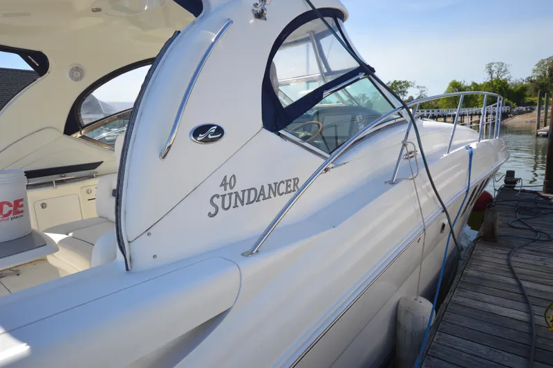Slide: The Image of 2006 Sea Ray 40 Sundancer yacht docked at marina, showcasing sleek design and luxury features. - 7