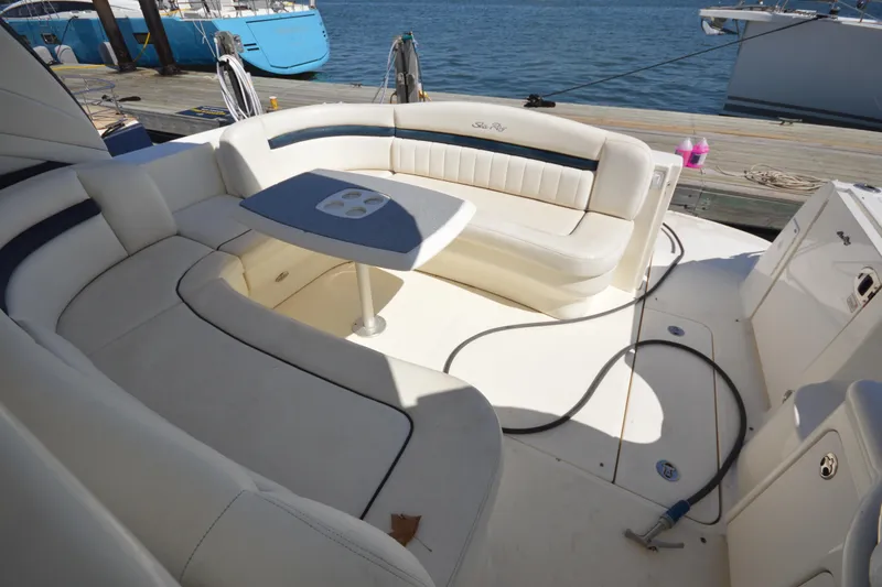 Slide: The Image of Luxurious seating area on a 2006 Sea Ray 40 Sundancer yacht, docked by the water. - 9