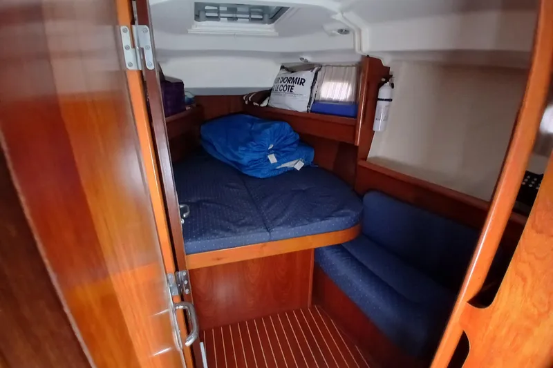 Slide: The Image of Cabin interior of 2002 Jeanneau Sun Odyssey 43 DS sailboat with cozy bedding. - 26