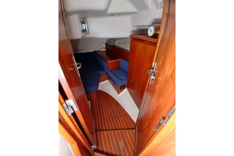 Slide: The Image of Cozy cabin interior of 2002 Jeanneau Sun Odyssey 43 DS sailboat with wooden finishes. - 29