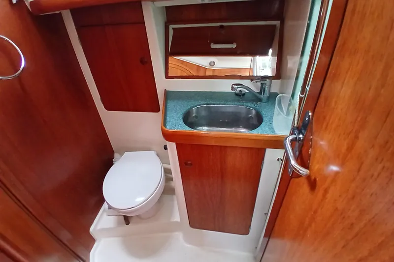 Slide: The Image of Bathroom interior of 2002 Jeanneau Sun Odyssey 43 DS yacht, featuring sink and toilet. - 35