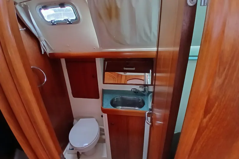 Slide: The Image of Interior of 2002 Jeanneau Sun Odyssey 43 DS yacht bathroom with sink and toilet. - 36