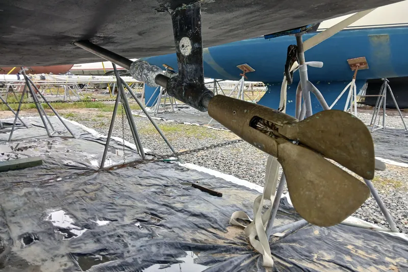 Slide: The Image of Propeller of 2002 Jeanneau Sun Odyssey 43 DS sailboat on stands in boatyard. - 52