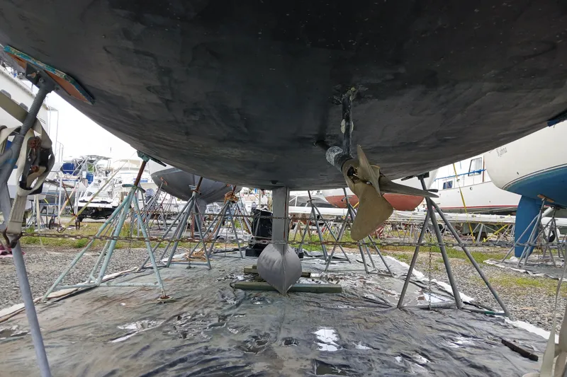 Slide: The Image of Underneath view of a 2002 Jeanneau Sun Odyssey 43 DS sailboat on stands. - 53