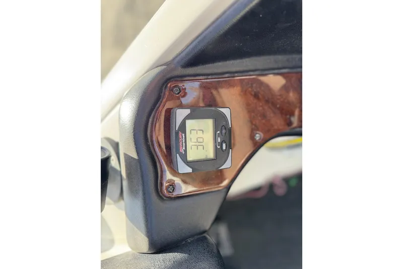 Slide: The Image of Digital display on 2006 Ranger 519 VX boat dashboard showing 363 hours. - 10