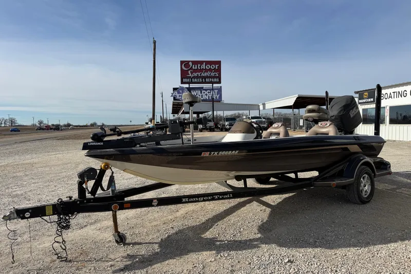 Slide: The Image of 2006 Ranger 519 VX boat on trailer at outdoor dealership. - 8