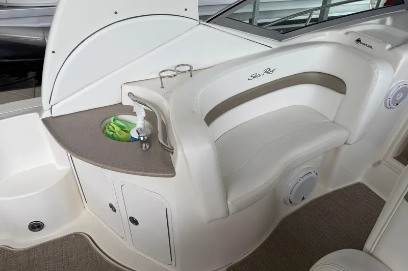 Slide: The Image of 2007 Sea Ray Sundancer 320 interior with seating, sink, and storage area. - 15