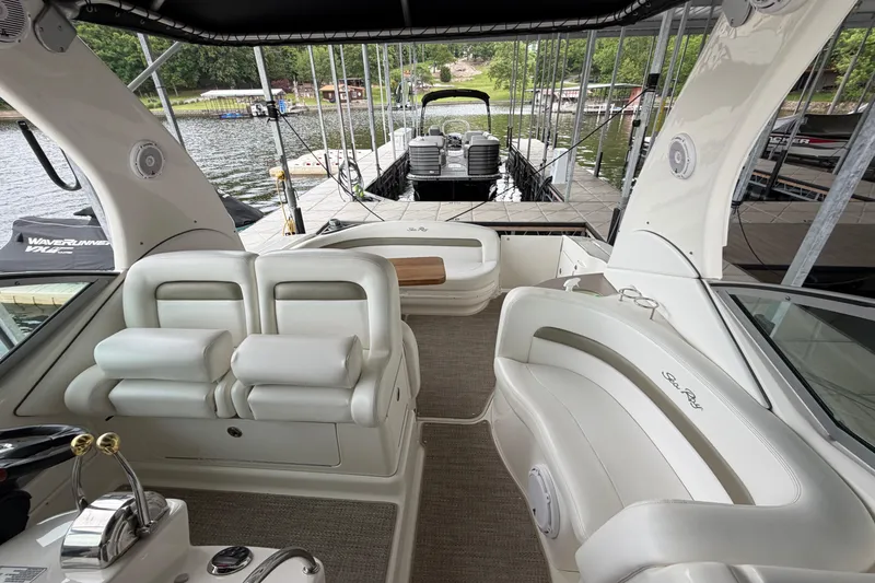 Slide: The Image of Interior of a 2007 Sea Ray Sundancer 320 yacht with luxurious seating and lake view. - 17
