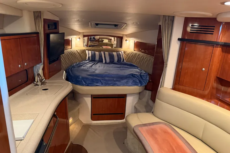 Slide: The Image of Interior of a 2007 Sea Ray Sundancer 320 yacht with bed and seating area. - 19
