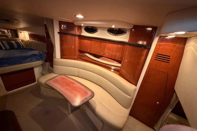 Slide: The Image of Luxurious interior of 2007 Sea Ray Sundancer 320 yacht with elegant wood cabinetry and seating. - 21
