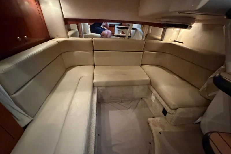 Slide: The Image of Interior of 2007 Sea Ray Sundancer 320 with beige seating and wooden accents. - 23