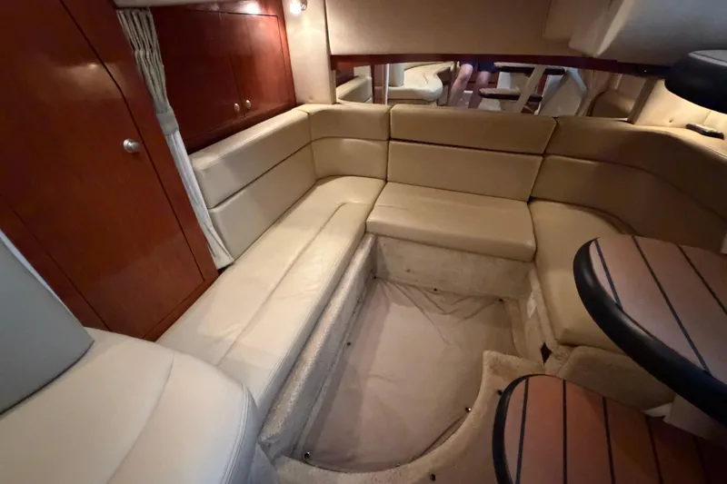 Slide: The Image of Luxurious interior of 2007 Sea Ray Sundancer 320 with beige seating and wooden accents. - 24