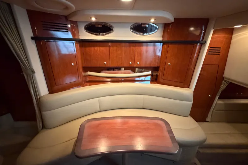 Slide: The Image of Luxurious interior of 2007 Sea Ray Sundancer 320 with elegant wood cabinetry and plush seating. - 25