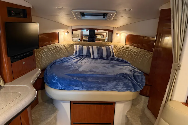 Slide: The Image of Luxurious cabin interior of 2007 Sea Ray Sundancer 320 with cozy bed and modern amenities. - 28