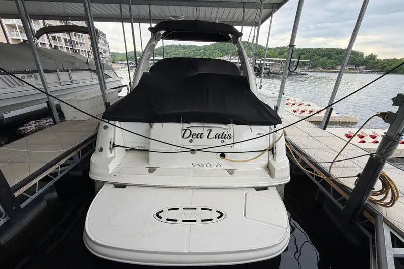Slide: The Image of 2007 Sea Ray Sundancer 320 docked at marina with covered deck. - 3