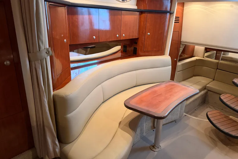 Slide: The Image of Luxurious interior of a 2007 Sea Ray Sundancer 320 yacht with elegant seating and wood finishes. - 30