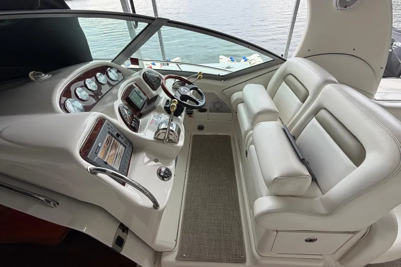 Slide: The Image of Interior cockpit of 2007 Sea Ray Sundancer 320 with dual seating and control panel. - 9