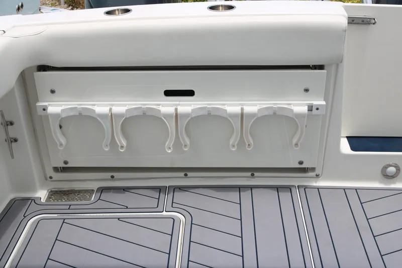 Slide: The Image of 2023 World Cat 280 DC-X boat interior with rod holders and sleek flooring design. - 15