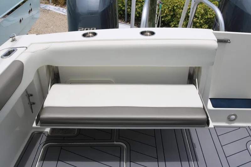 Slide: The Image of 2023 World Cat 280 DC-X boat with foldable seating and cup holders on deck. - 16