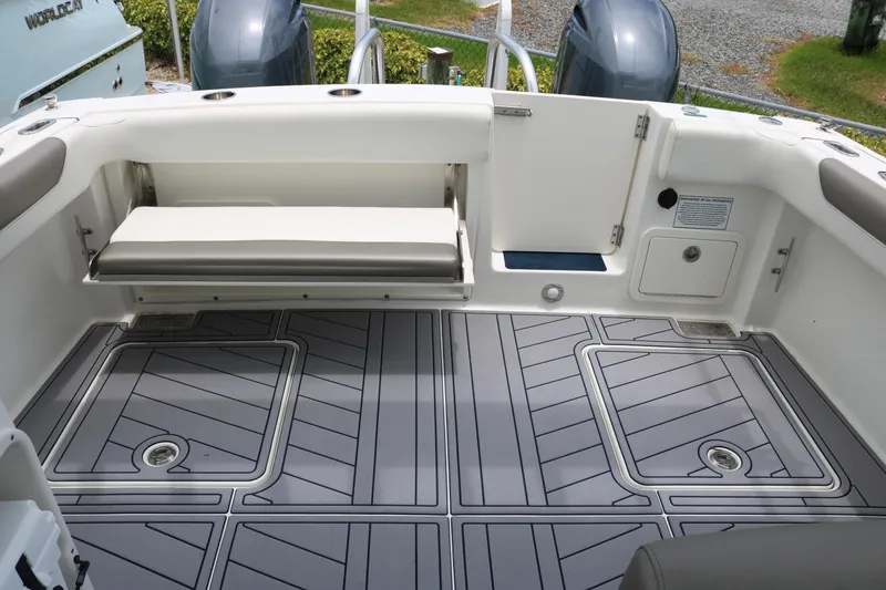 Slide: The Image of 2023 World Cat 280 DC-X boat interior with sleek seating and modern flooring design. - 17