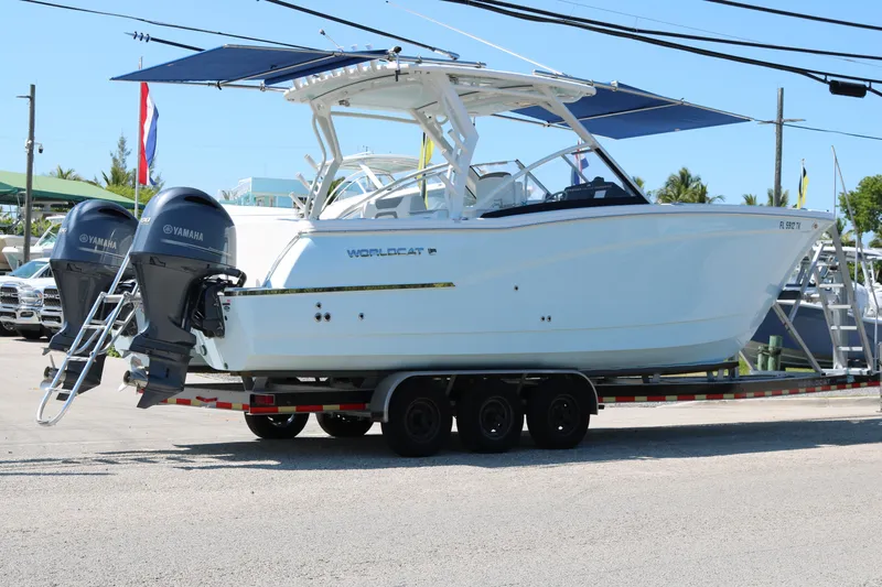 Slide: The Image of 2023 World Cat 280 DC-X boat on trailer with twin Yamaha engines. - 3