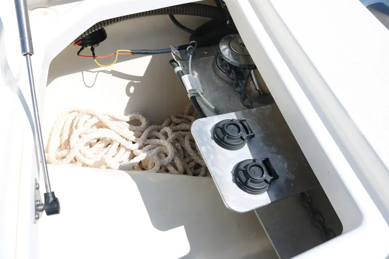 Slide: The Image of Storage compartment of 2023 World Cat 280 DC-X boat with rope and equipment. - 5