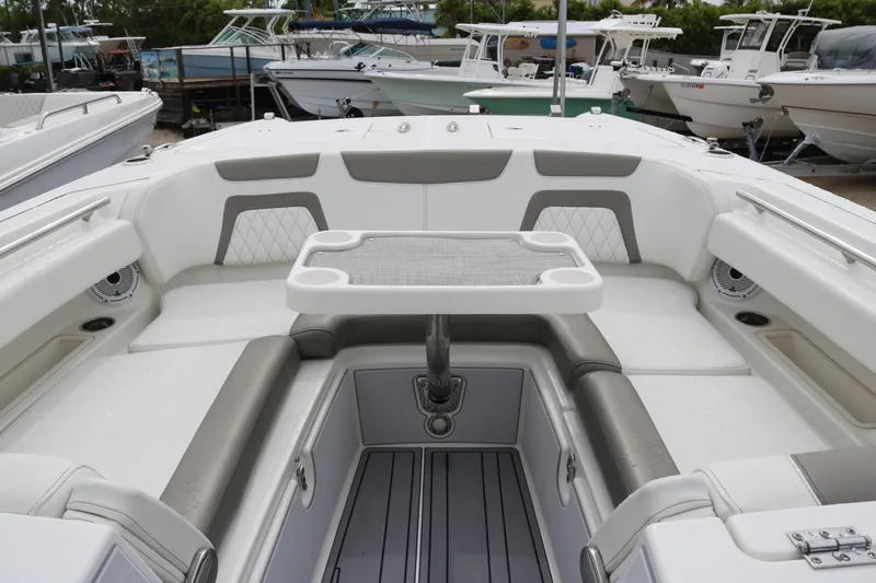 Slide: The Image of Interior view of 2023 World Cat 280 DC-X boat with seating and table. - 6