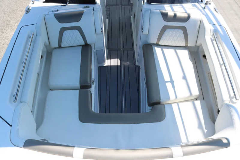Slide: The Image of 2023 World Cat 280 DC-X boat interior with cushioned seating and sleek design. - 7