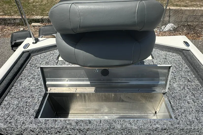 Slide: The Image of 2026 Tracker Pro Team 170 TX boat seat with open storage compartment. - 16