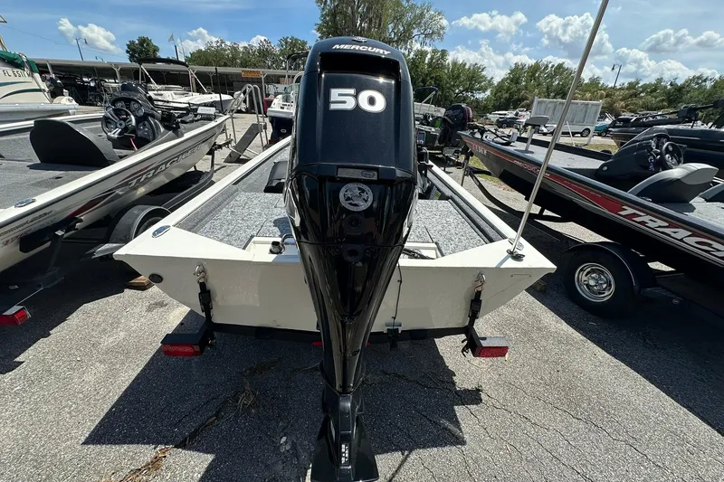 Slide: The Image of 2026 Tracker Pro Team 170 TX boat with Mercury 50 engine, parked outdoors. - 18