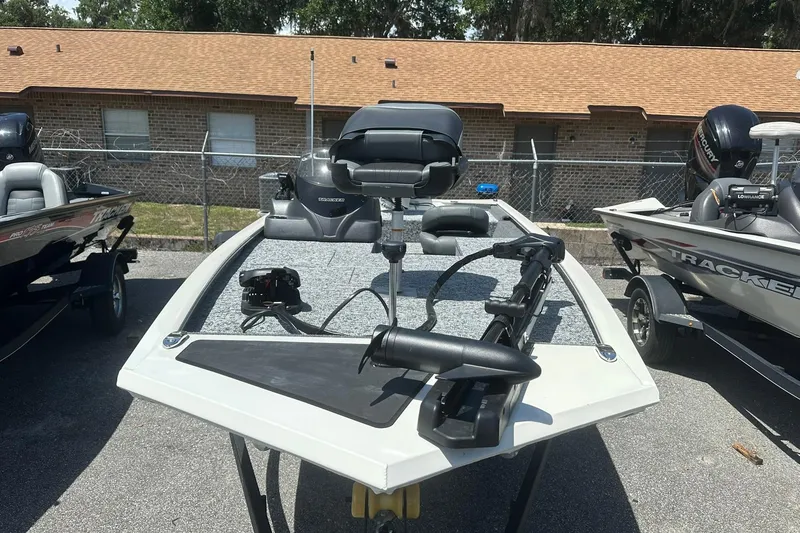Slide: The Image of 2026 Tracker Pro Team 170 TX fishing boat with advanced equipment, parked outdoors. - 3