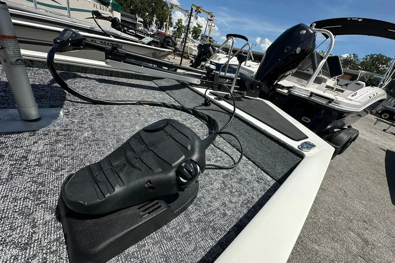 Slide: The Image of 2026 Tracker Pro Team 170 TX boat deck with trolling motor and foot pedal. - 4