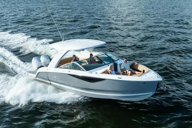 The Image of Manufacturer Provided Image: 2026 Four Winns H33 OB boat cruising on open water with passengers onboard. - 0