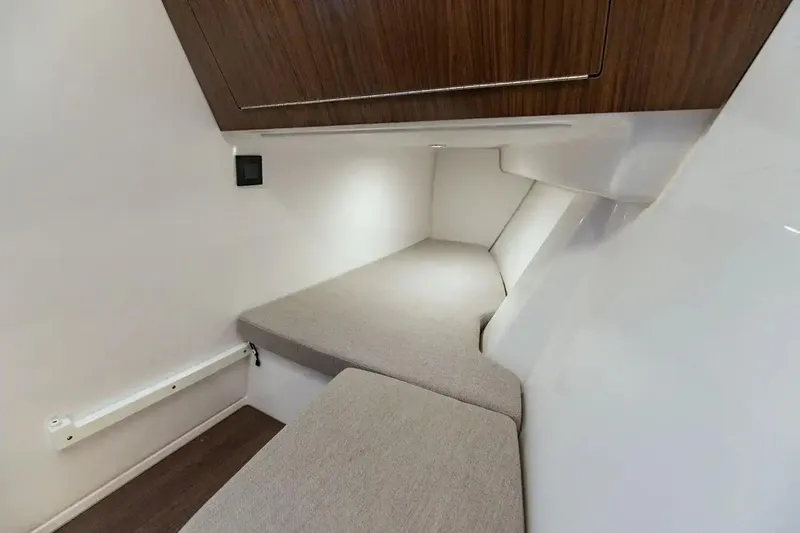 Slide: The Image of Manufacturer Provided Image: Interior cabin of 2026 Four Winns H33 OB boat, featuring sleek design and comfortable seating. - 7
