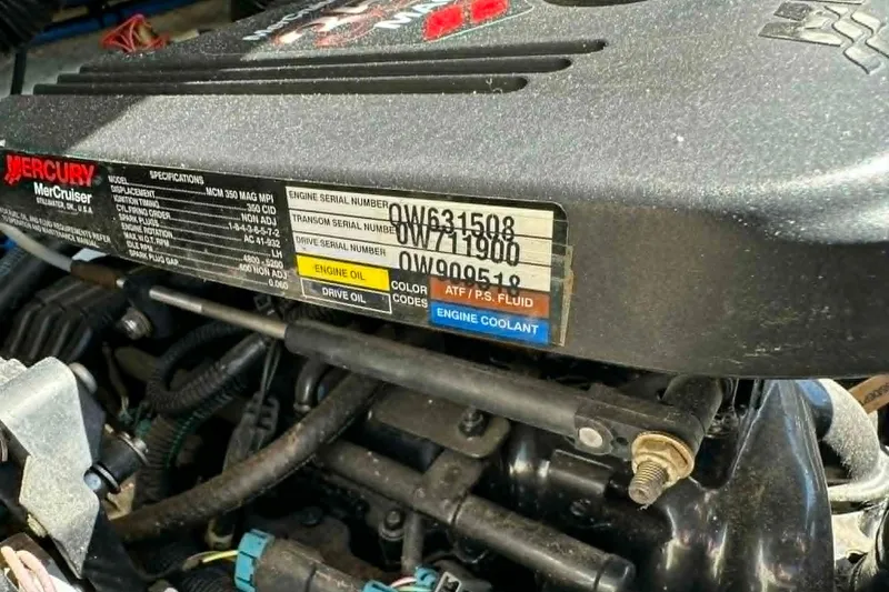 Slide: The Image of Engine compartment of a 2006 Sea Ray 240 Sundeck with Mercury MerCruiser specifications. - 10