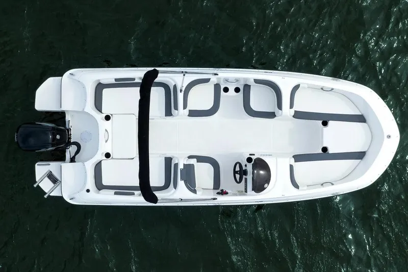 Slide: The Image of Manufacturer Provided Image: 2025 Bayliner Element E18 boat, aerial view, white and gray seating, on water. - 7