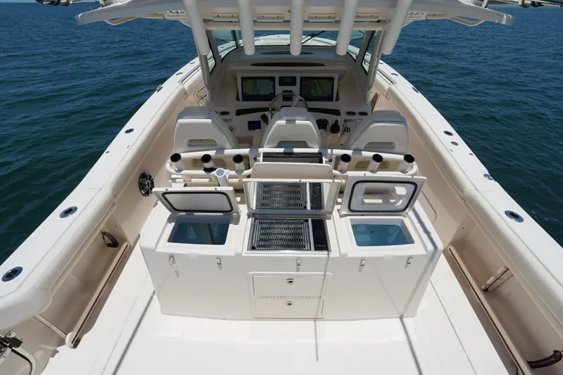 Slide: The Image of 2020 Grady-White Canyon 376 boat interior with open storage compartments on the ocean. - 19