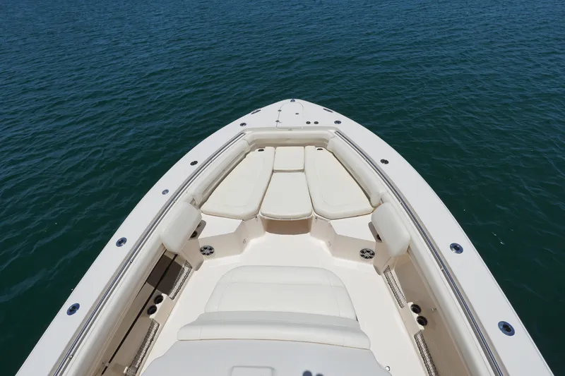 Slide: The Image of 2020 Grady-White Canyon 376 boat bow with cushioned seating on open water. - 2
