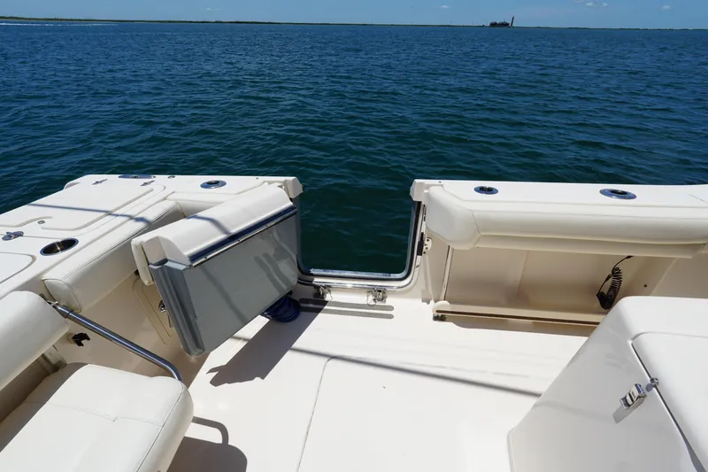 Slide: The Image of 2020 Grady-White Canyon 376 boat deck with ocean view, featuring comfortable seating. - 21