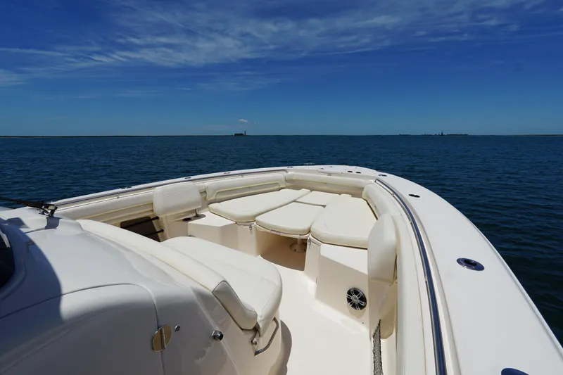 Slide: The Image of 2020 Grady-White Canyon 376 boat on open water, featuring spacious seating and clear skies. - 3