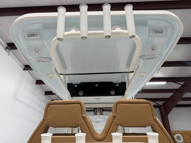 Slide: The Image of Key West 239 FSR 2026 boat roof with fishing rod holders. - 11