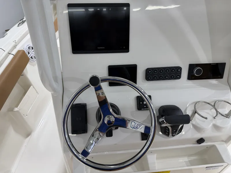 Slide: The Image of Key West 239 FSR 2026 helm with Garmin display and controls. - 22